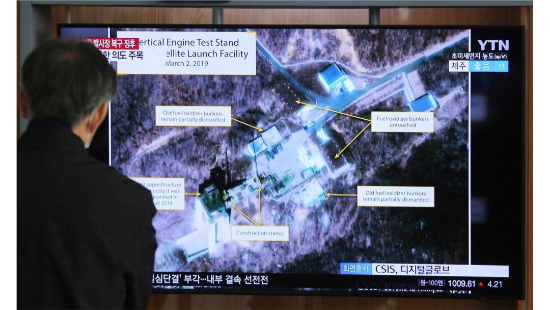 FILE - In this March 6, 2019 file photo, a man watches a TV screen showing an image of the Sohae Satellite Launching Station in Tongchang-ri, North Korea, during a news program at the Seoul Railway Station in Seoul, South Korea.