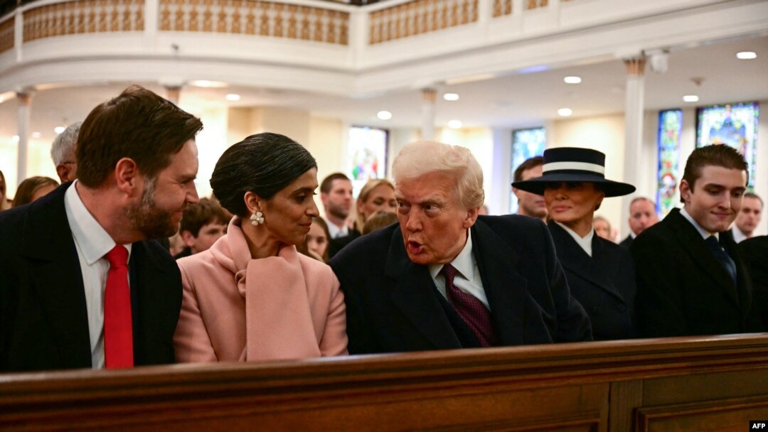 U.S. President-elect Donald Trump speaks with Vice President-elect JD Vance (L) and Usha Vance, second from left, during a church service at St. John's Episcopal Church, Lafayette Square in Washington, D.C., Jan. 20, 2025. Melania Trump and son Barron Trump are to the right.