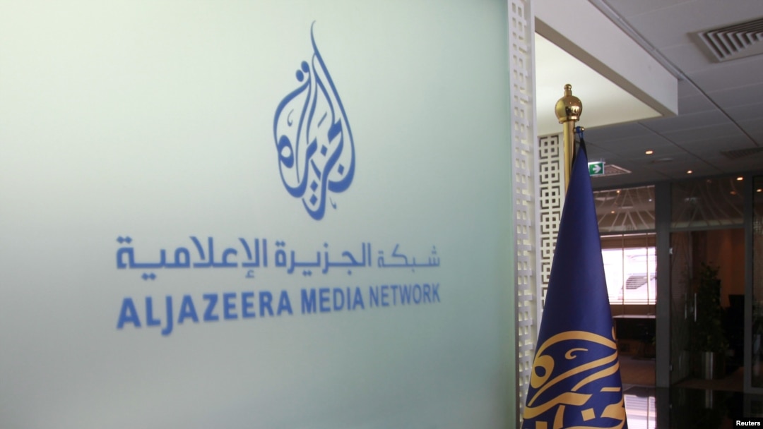 The Al Jazeera Media Network logo is seen inside its headquarters in Doha, Qatar, June 8, 2017. Israeli officials confirmed on March 30, 2024, the killings of two Palestinian men by Israeli troops on Gaza's beach, shown in a video broadcast by Al Jazeera.