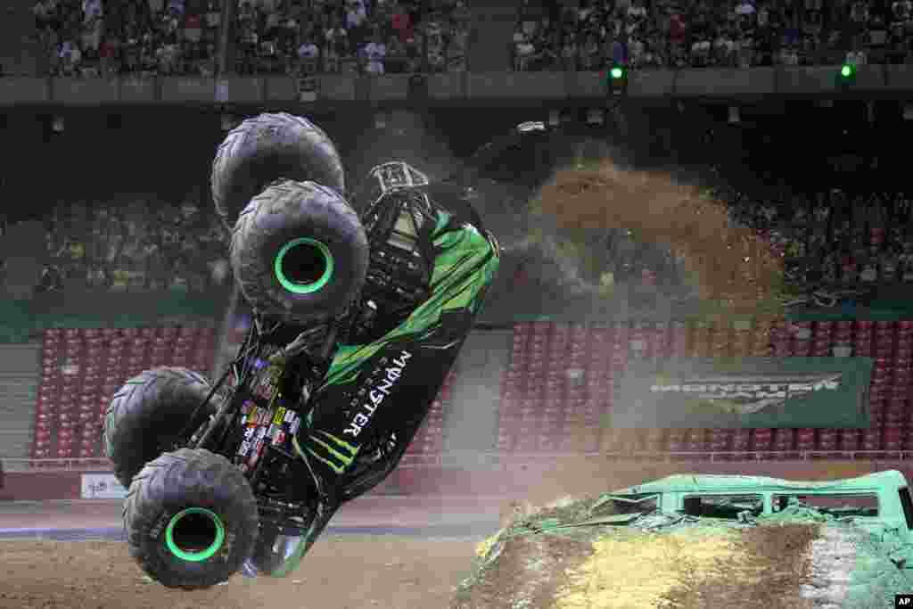 A Monster Jam truck performs a back flip during the first-ever monster truck event in Beijing's iconic "Bird's Nest" National Stadium, China, July 29, 2017.