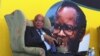 South African president Jacob Zuma, in front of a portrait of former African National Congress president Oliver Tambo, addresses foreign correspondents at a breakfast in Johannesburg, Oct. 29, 2012. 