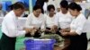 ၂၀၁၀ ရွေးကောက်ပွဲမှာ ရရှိထားတဲ့ မဲတွေကို ရေတွက်နေကြစဉ်။