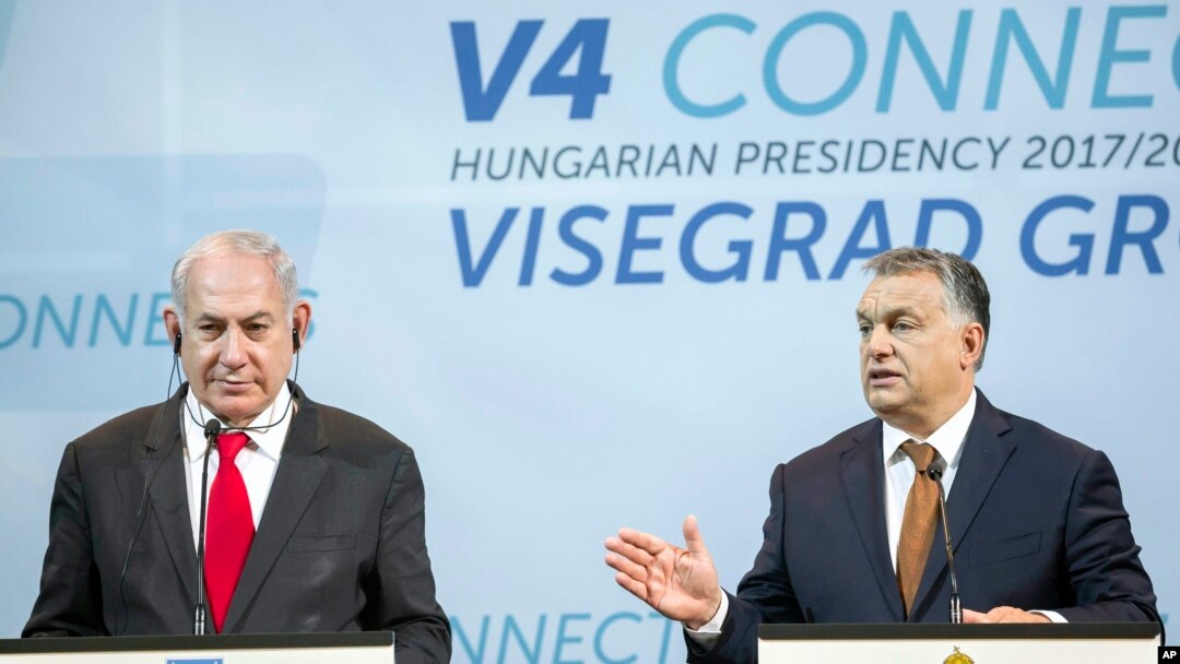 Israeli Prime Minister Benjamin Netanyahu, left, listens to Hungarian Prime Minister Viktor Orban during a press conference held after the talks of Netanyahu with heads of government of the Visegrad Group in the Pesti Vigado building in Budapest, Hungary, July 19, 2017.
