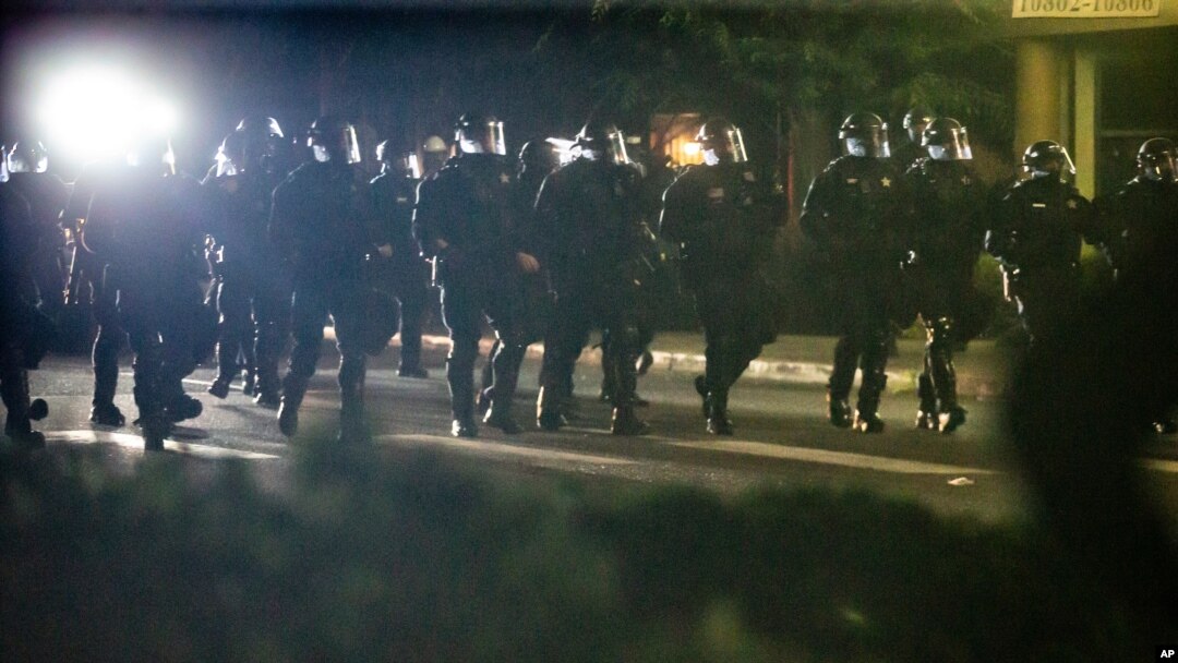 Police respond to demonstrators gathered at Floyd Light City Park, Aug. 6, 2020 in Portland, Ore.