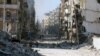 Syrians walk over rubble of damaged buildings, as they flee clashes between government forces and rebels in Tariq al-Bab and al-Sakhour neighborhoods of eastern Aleppo towards other rebel held besieged areas of Aleppo, Nov. 28, 2016.