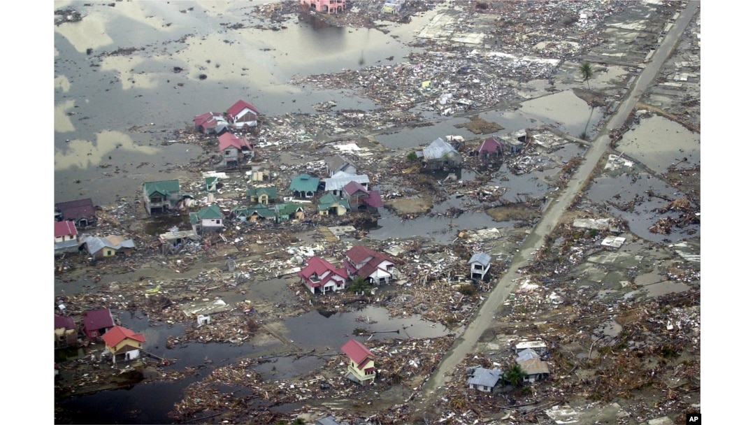 FILE - Destroyed houses are seen in this aerial view of the town of Meulaboh in Aceh province, Indonesia, which was flattened by tidal waves, Jan. 1, 2005.