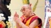 The Dalai Lama prays at the Dieu Ngu Temple in Westminster, Calif., June 18, 2016.