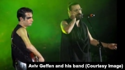 Exiled Iranian rock musician Shahin Najafi, right, sang alongside Israeli rock star Aviv Geffen, left, at a concert in Tel Aviv -- the first performance by an Iranian artist at an Israeli rock concert -- on March 2, 2017.